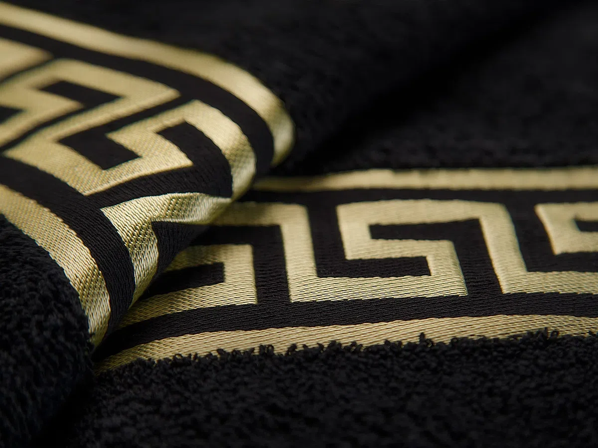 Alfombrilla de baño de algodón en color beige, negro, blanco, dorado, con diseño de meandros (negro, juego de 2 unidades – 50 x 90 + 50 x 60)