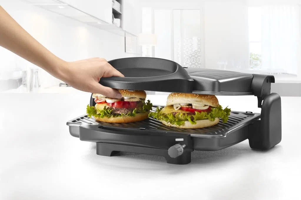 Delonghi Grigliatutto CG298.BK Parilla Eléctrica, 1800 W, Acero Inoxidable/Revestimiento Antiadherente, 3 Velocidades, Negro