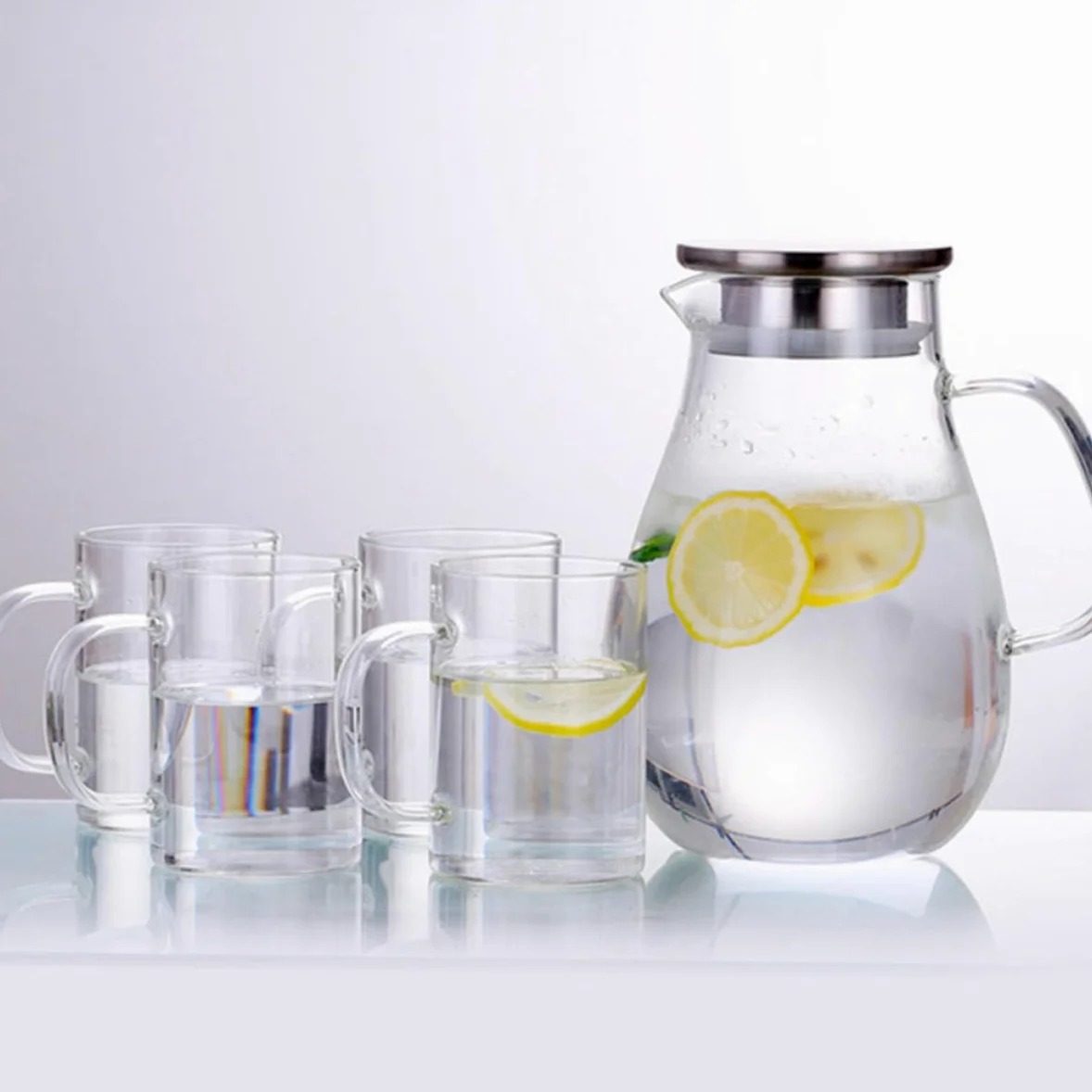 Jarra de Agua de Vidrio con Tapa de Acero Inoxidable, Capacidad Grande, Fácil de Limpiar y Previene Salpicaduras para Uso Doméstico