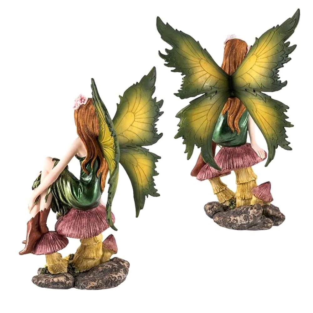 Hada sentada figura de 25 cm. sobre setas imagen acabada en resina