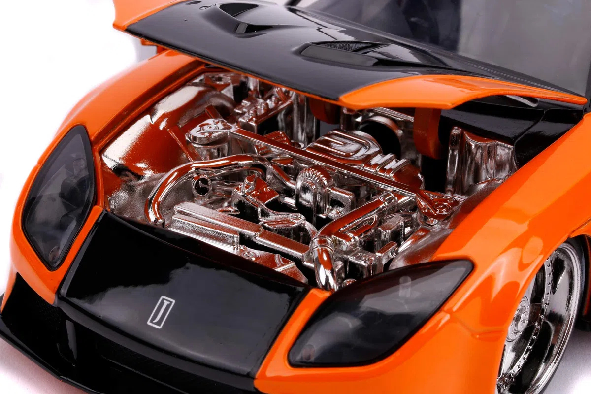 Jada Toys 253203058 Fast & Furious Han's Mazda RX-7 - Coche Tuning a Escala 1:24 con alerón, Puertas Que se abren, capó y Maletero, Rueda Libre, Color Naranja